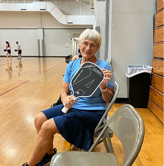 APL player with a custom pickleball paddle